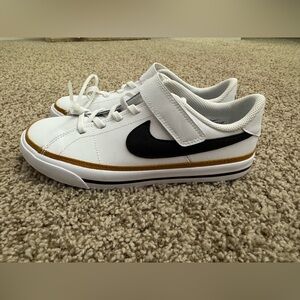 Nike Kids White and Black Sneakers with Gold Accents